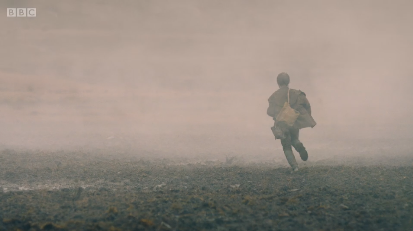 child runs away into the smoke