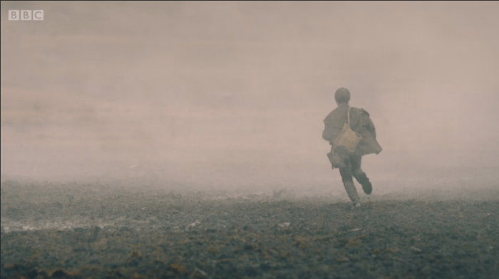 child runs away into the smoke